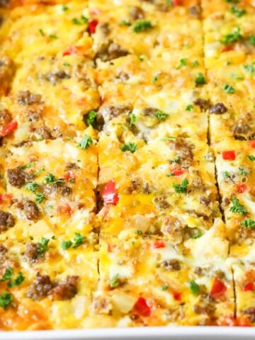 Close-up view of a breakfast casserole that's been cut into squares.