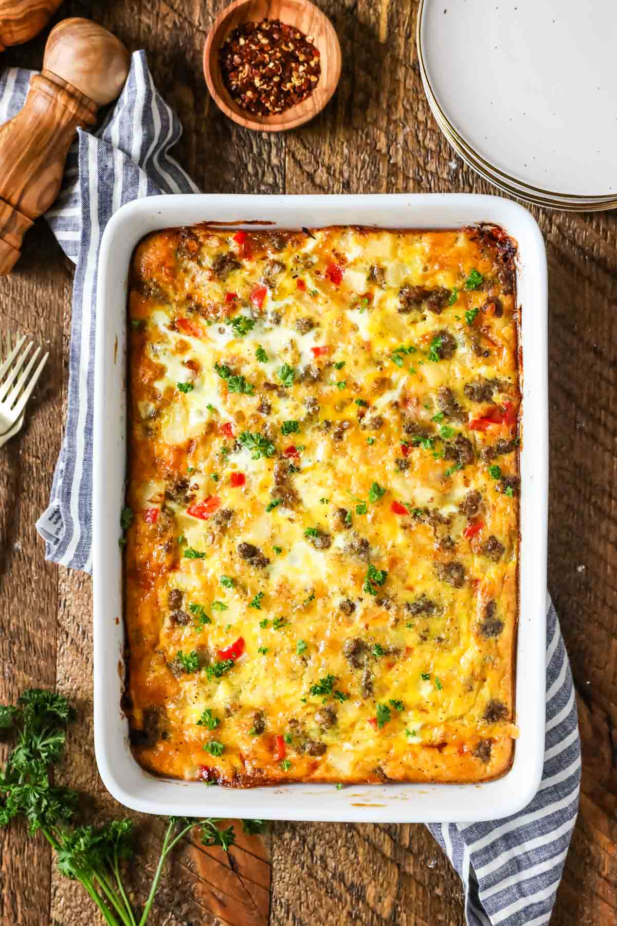 Overhead view of a casserole made with eggs, peppers, sausage, and more.