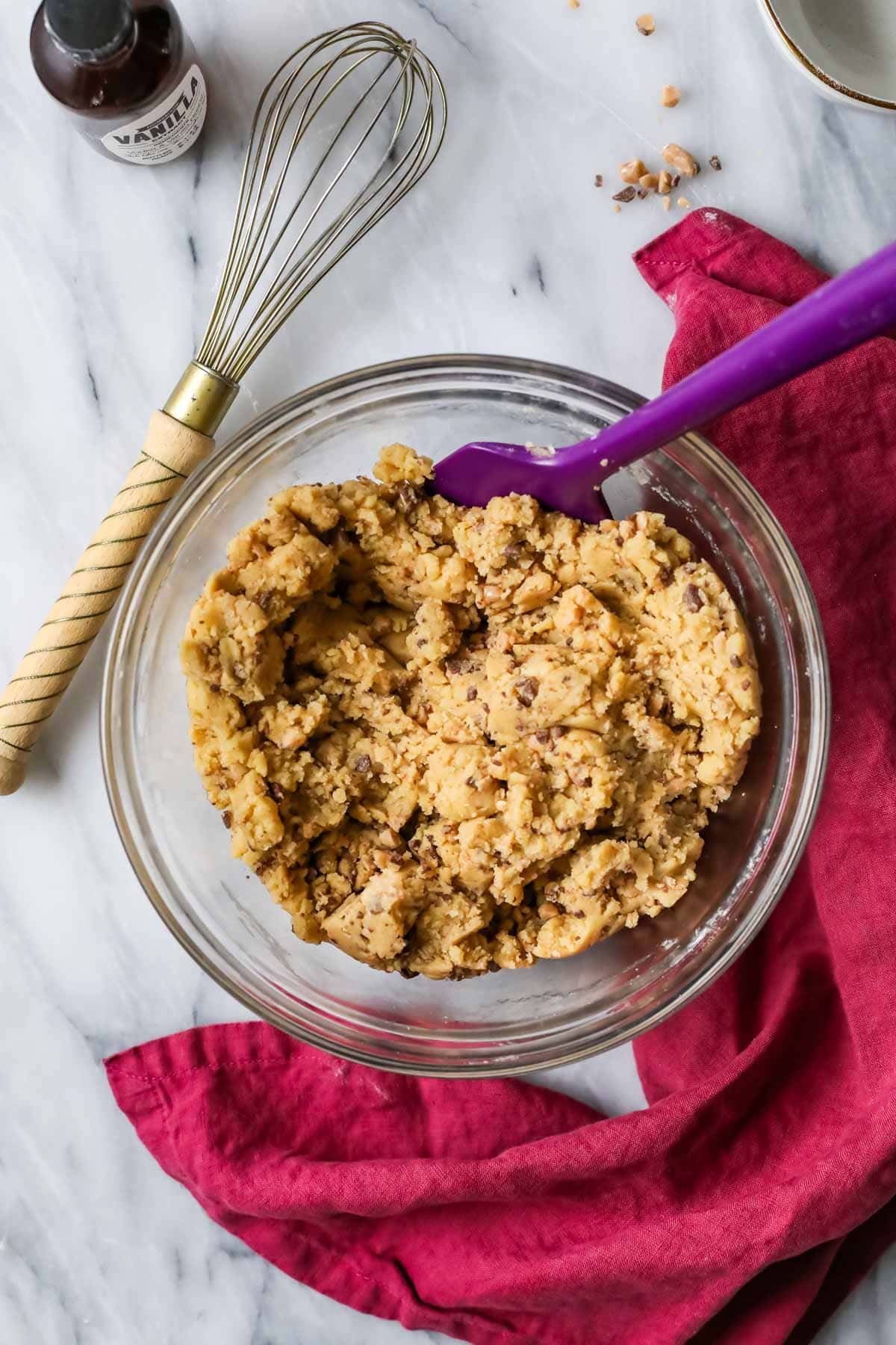 Overhead view of a bowl of cookie dough made with brown butter and toffee.