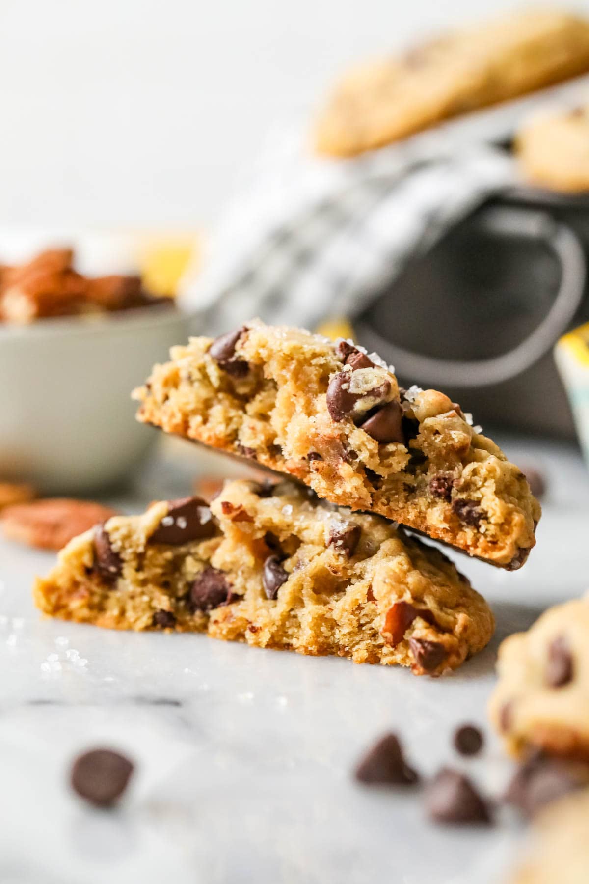 Two halves of chocolate chip banana bread cookies stacked on top of each other.