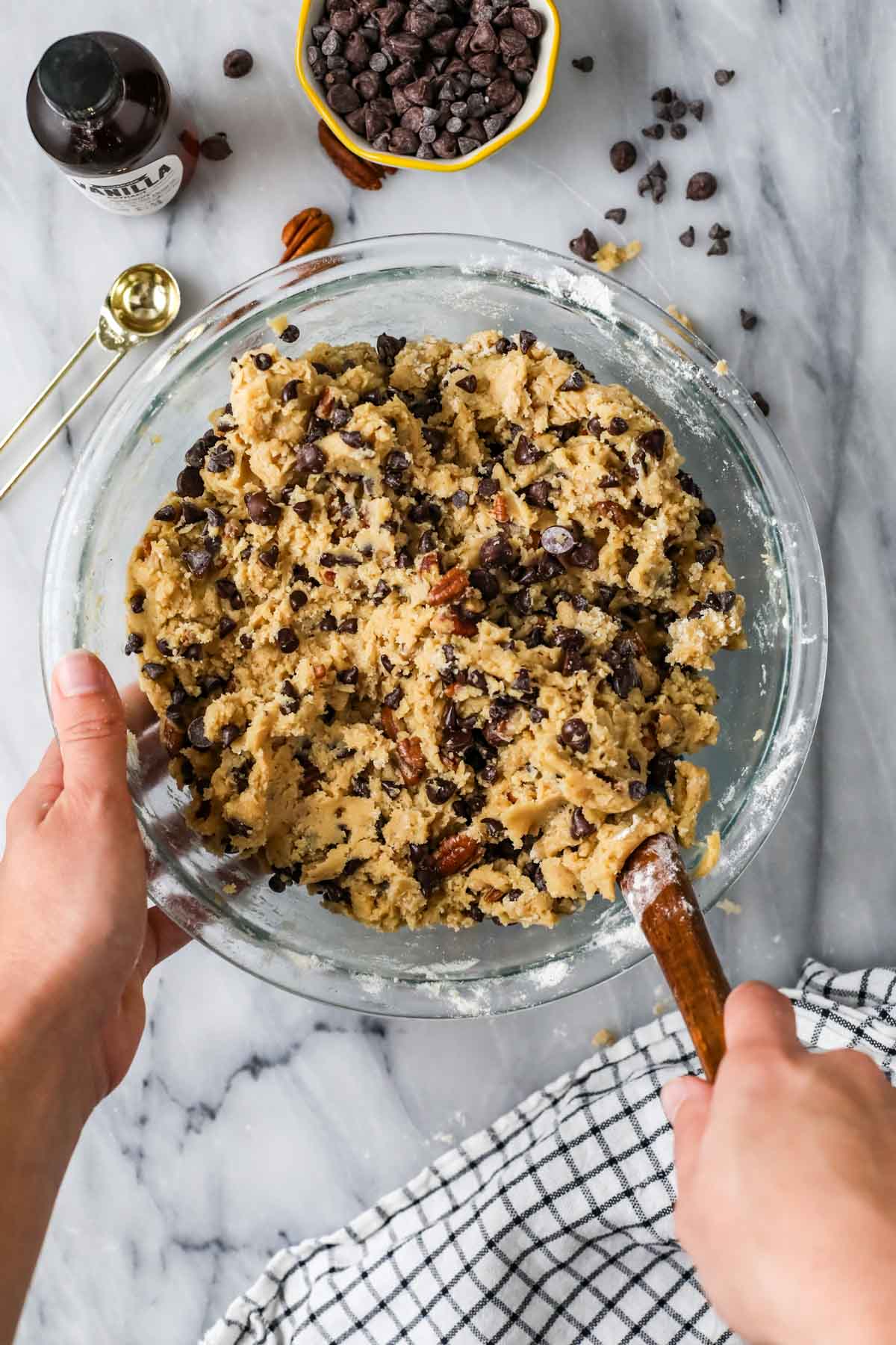 Overhead view of a bowl of cookie dough made with mashed bananas, brown butter, pecans, and more.