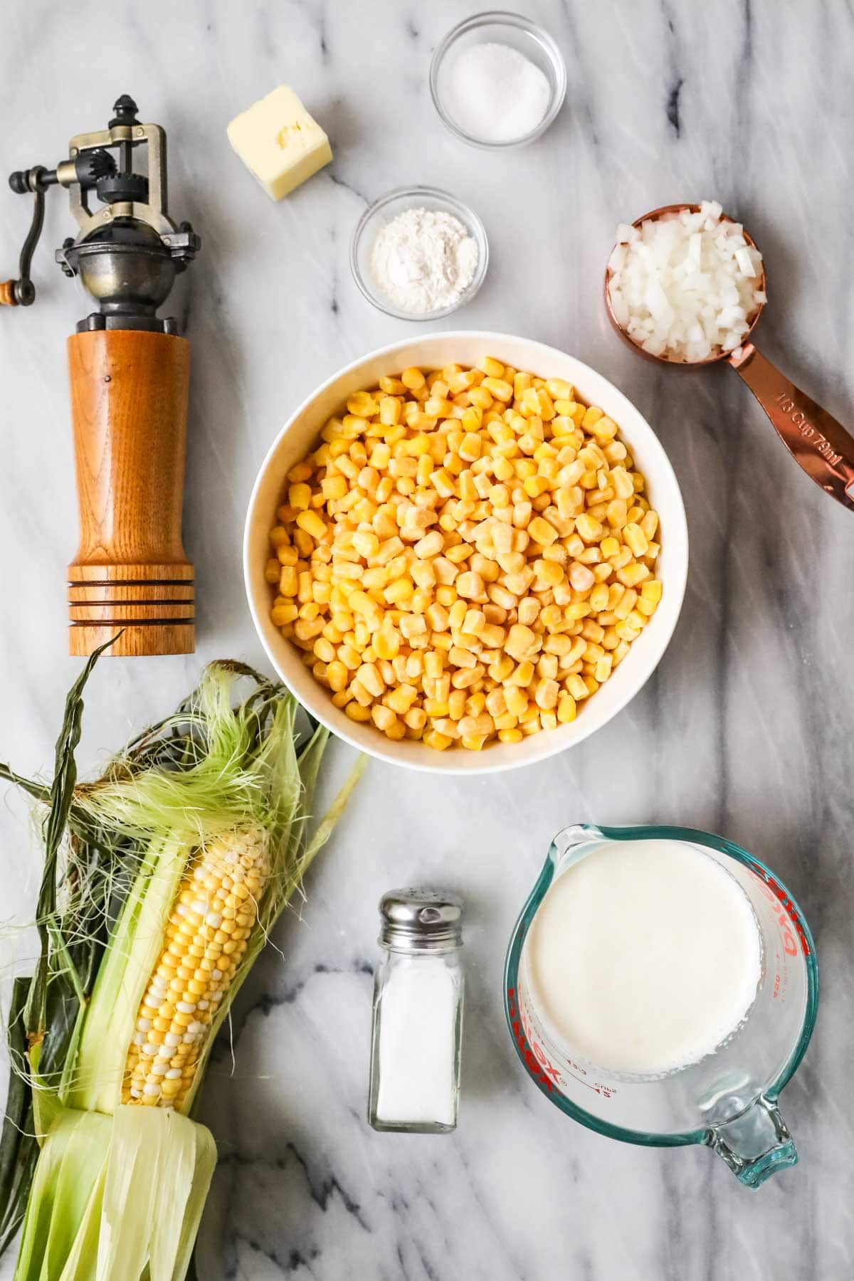 Overhead view of ingredients including corn, half and half, onion, and more.