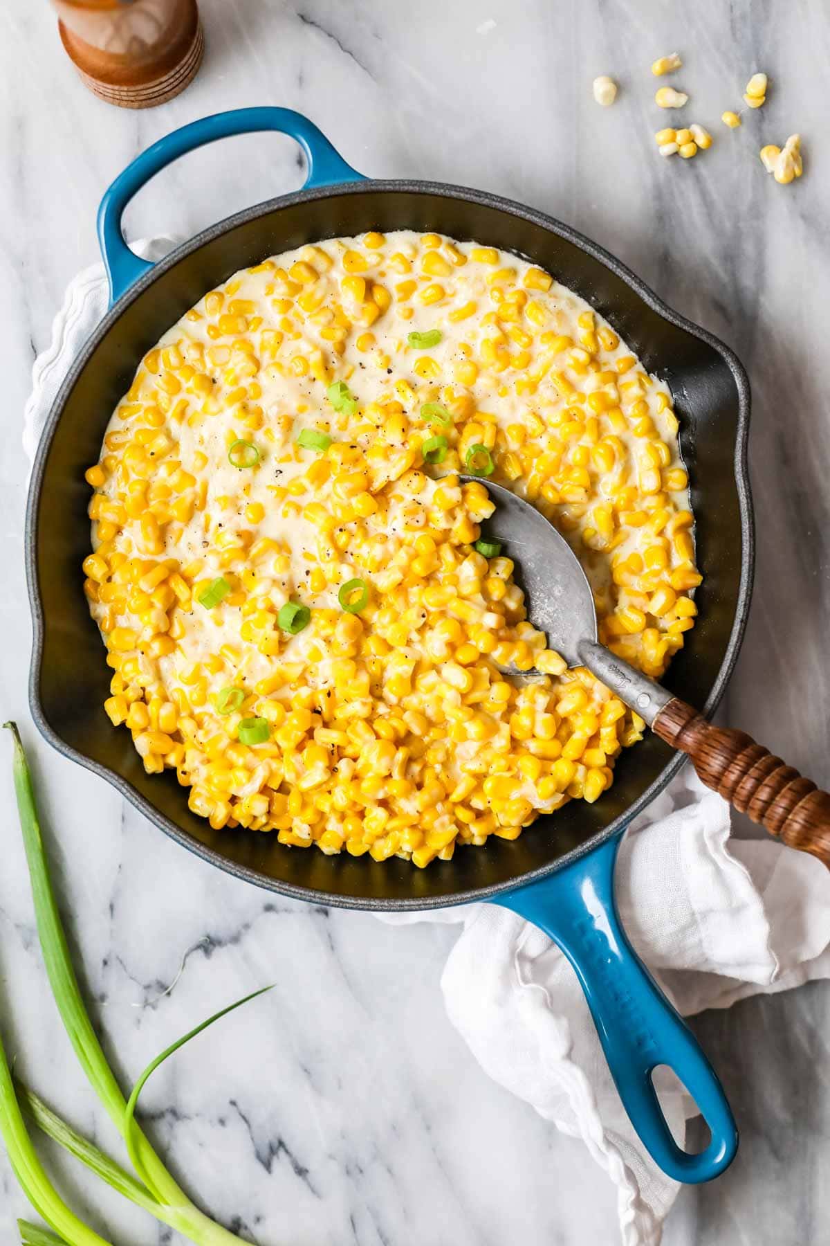 Overhead view of creamed corn in a skillet.