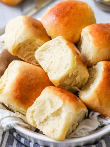 Serving bowl of sourdough dinner rolls.