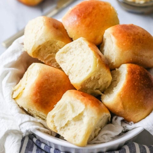 Serving bowl of sourdough dinner rolls.