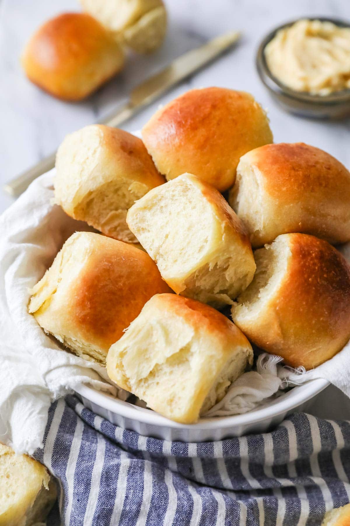 Serving bowl of sourdough dinner rolls.