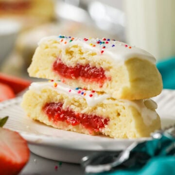 Two strawberry pop tart cookies stacked on top of each other.