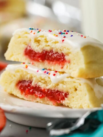 Two strawberry pop tart cookies stacked on top of each other.