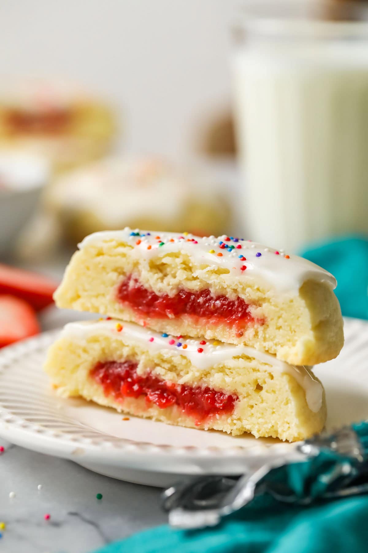 Two strawberry pop tart cookies stacked on top of each other.