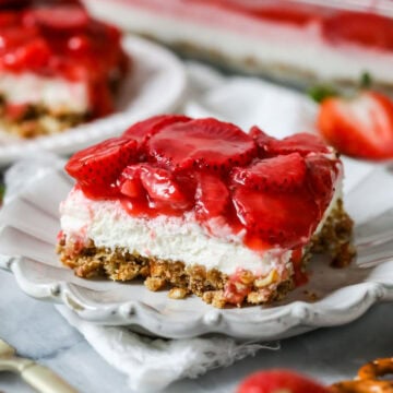 Slice of strawberry pretzel salad made completely from-scratch.