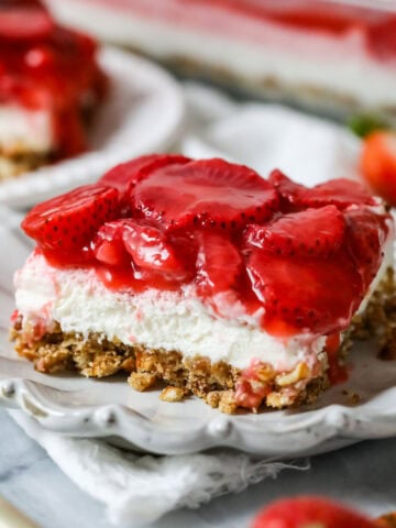 Slice of strawberry pretzel salad made completely from-scratch.