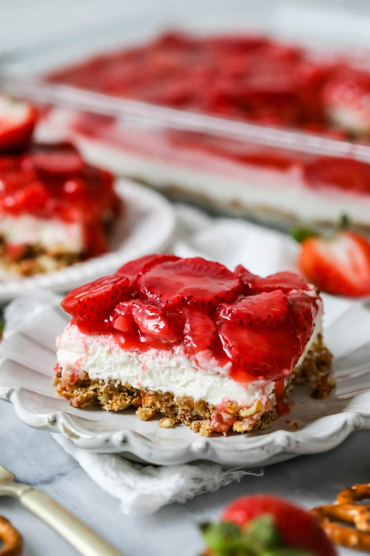 Slice of strawberry pretzel salad made completely from-scratch.