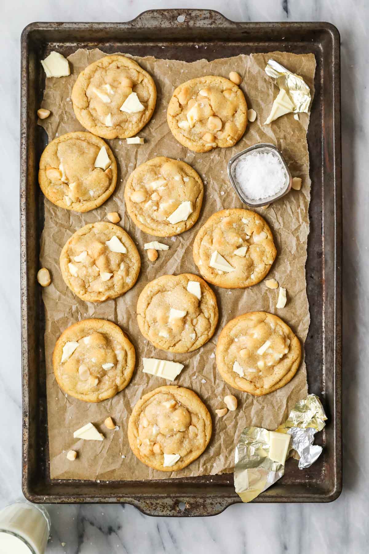 Overhead view of a tray of cookies made with white chocolate and macadamia nuts.