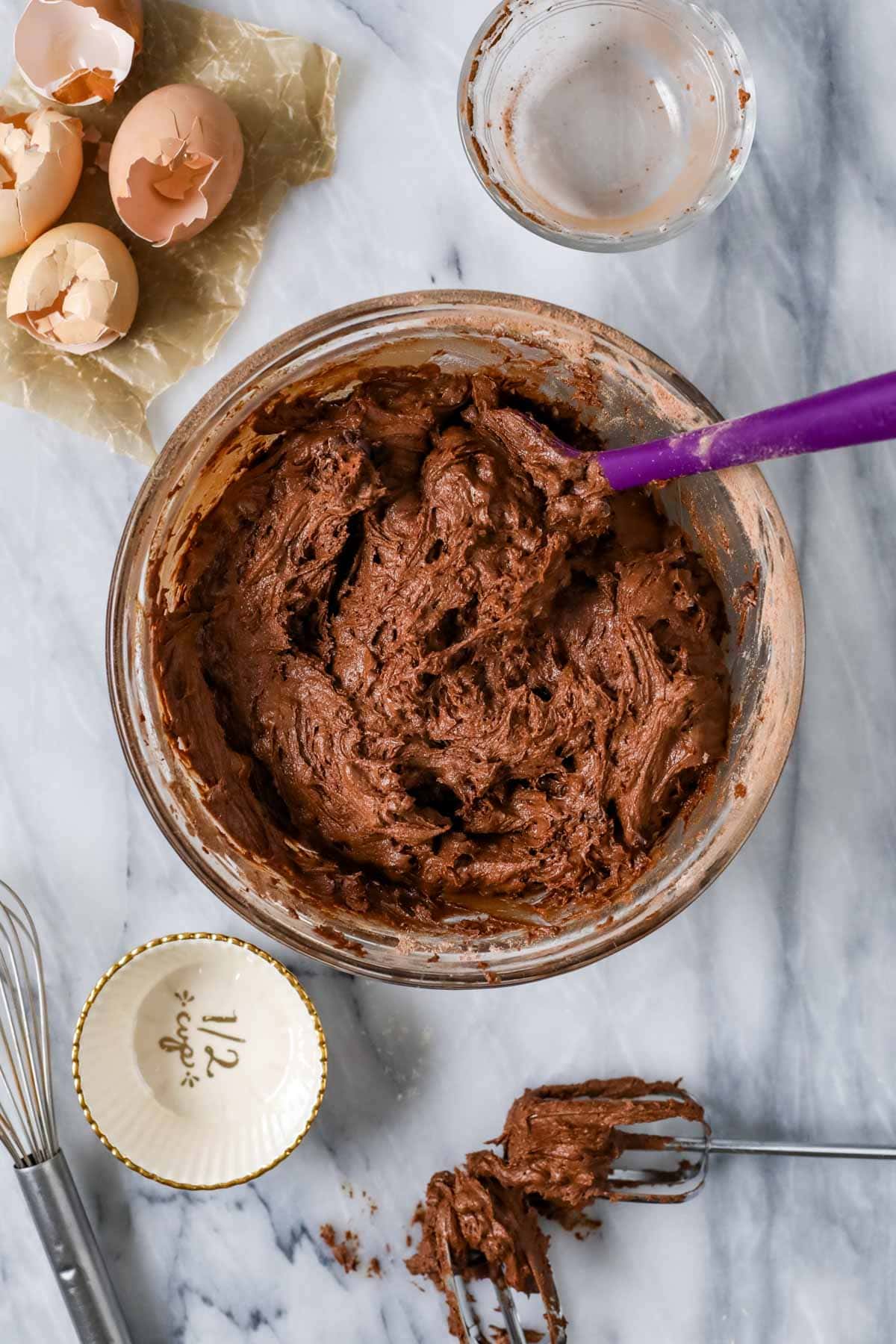 Overhead view of a bowl of chocolate cookie dough.