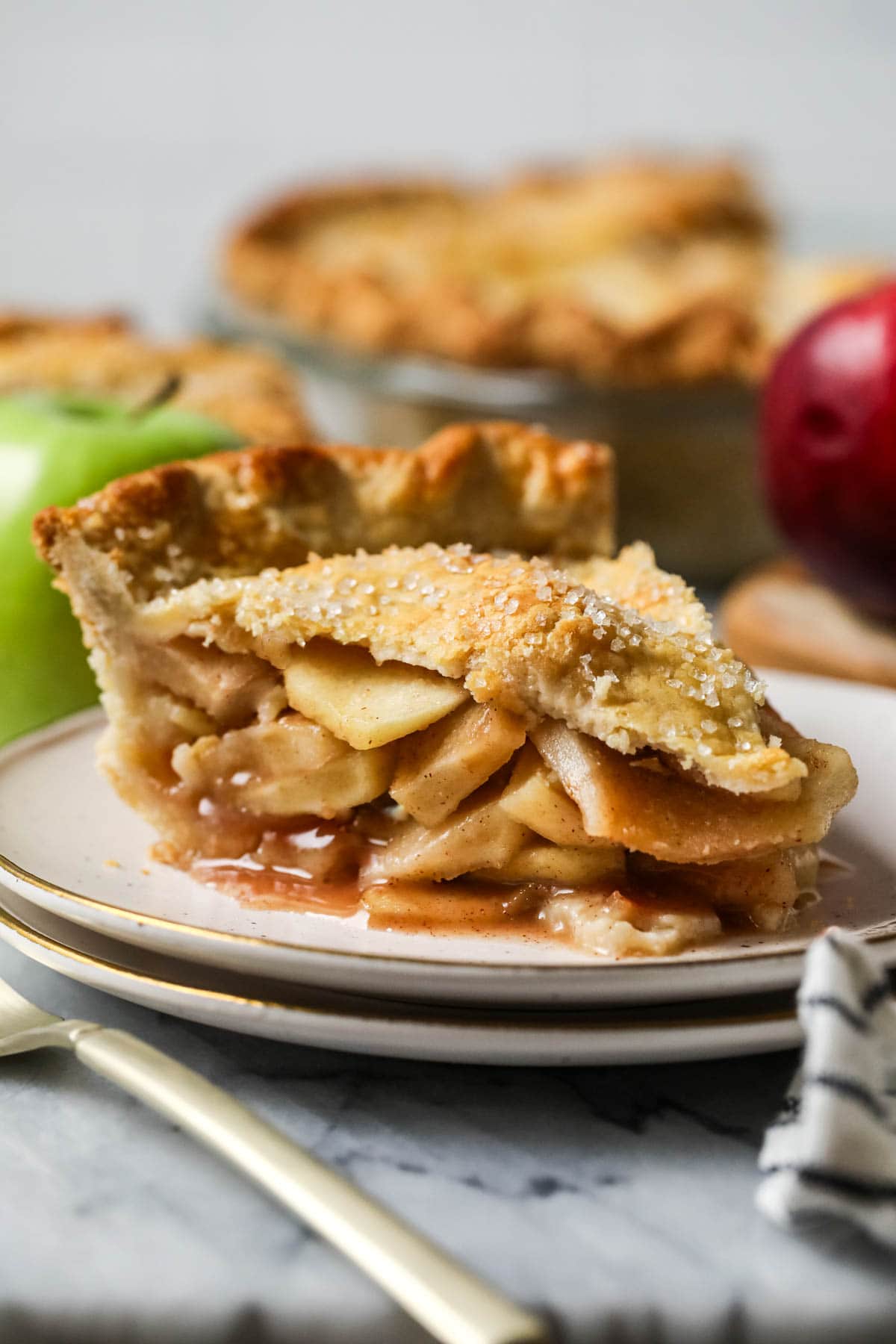 Slice of apple pie on a plate.