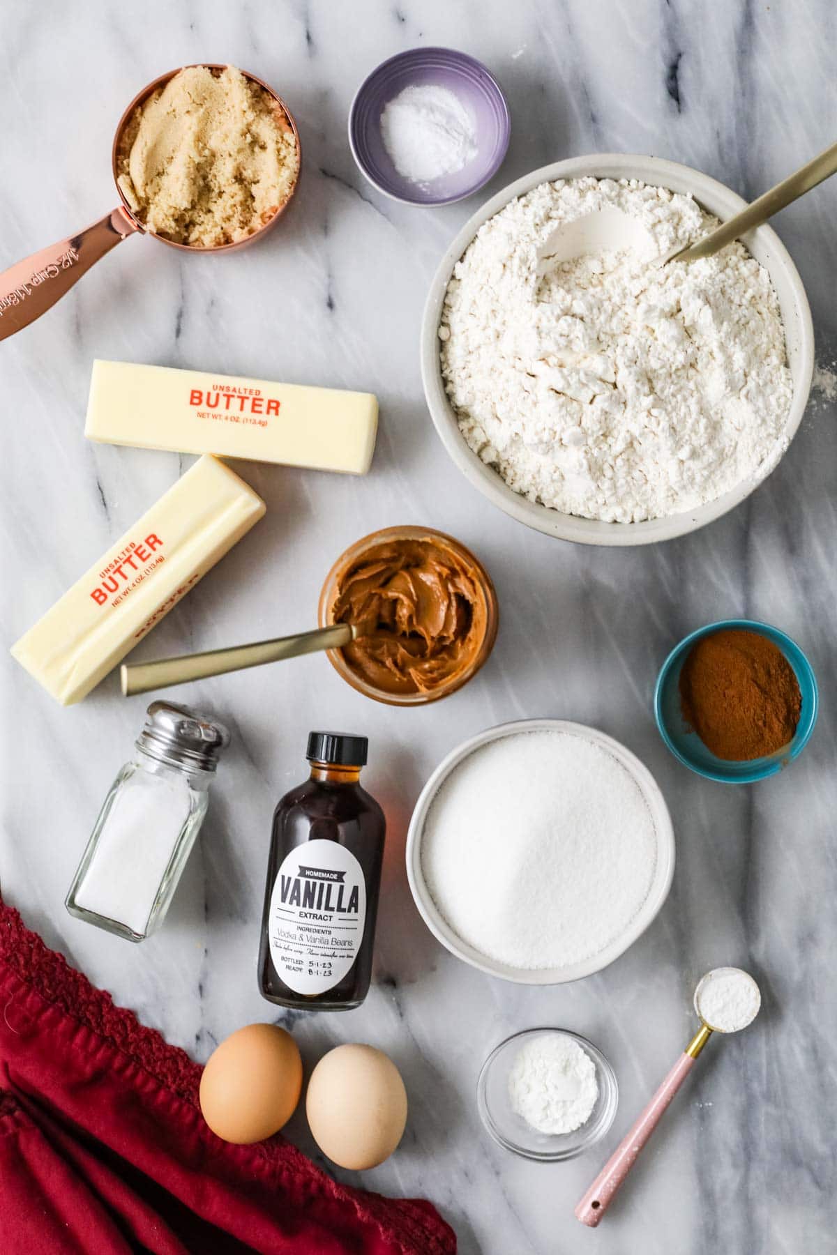 Overhead view of ingredients including cookie butter, cinnamon, cream of tartar, and more.