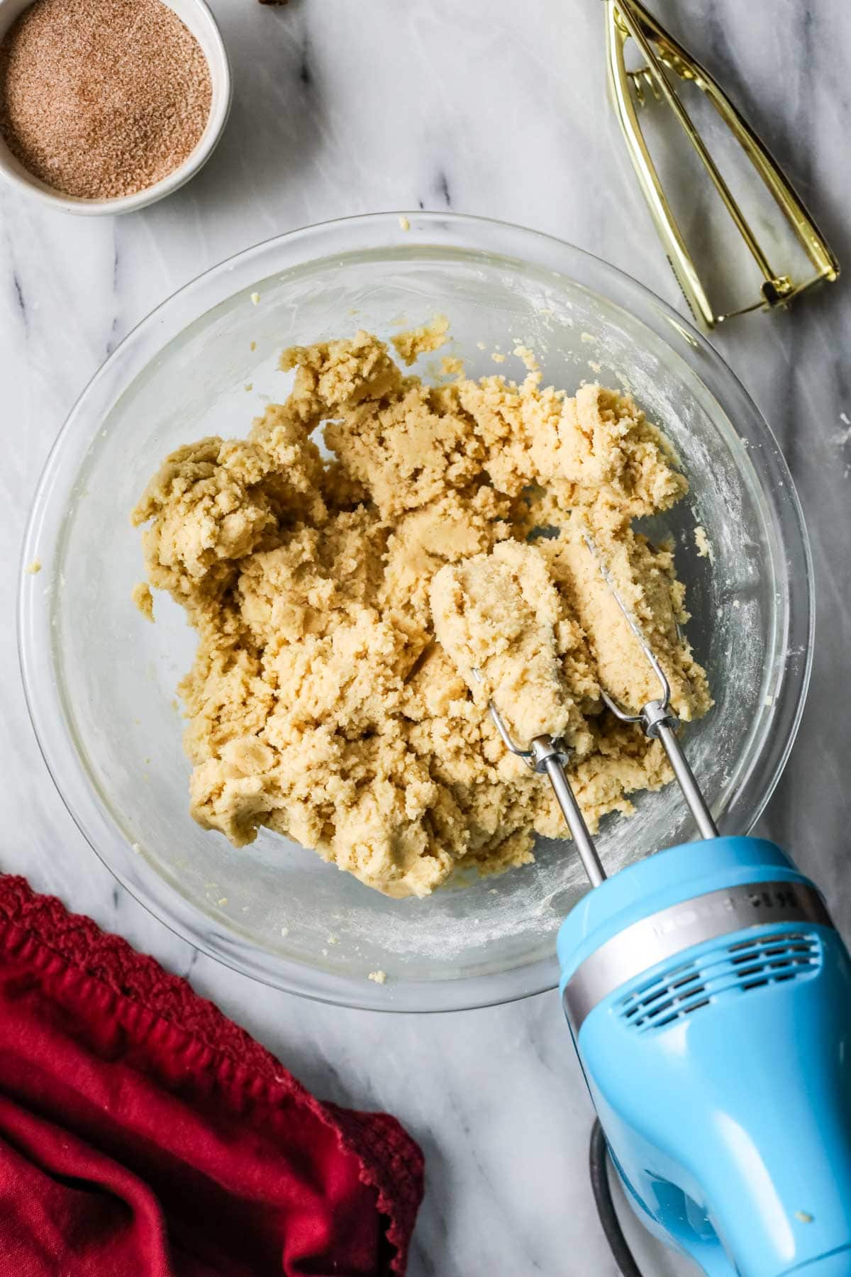 Overhead view of a cookie dough in a bowl after mixing with a hand mixer.