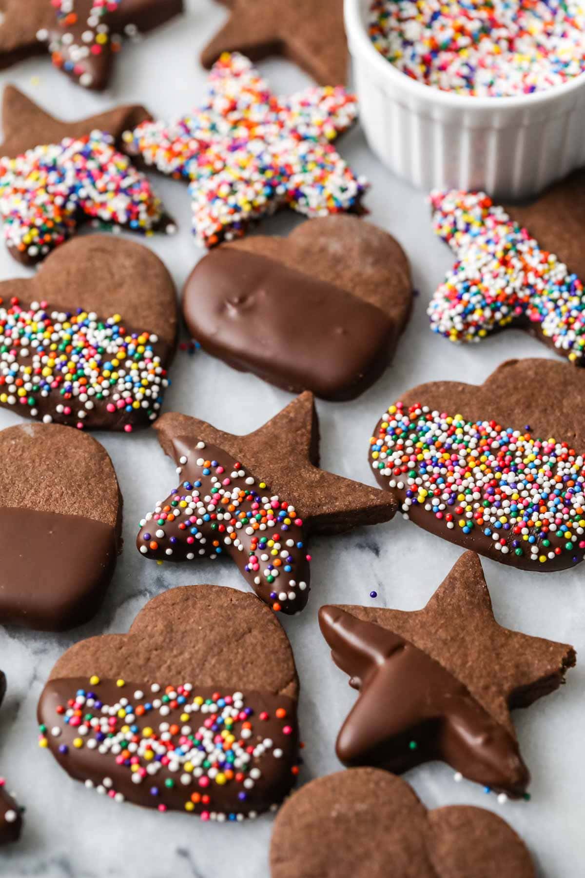 Close-up view of chocolate dipped shortbread cookies made with cocoa powder.