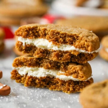 Two halves of a gingerbread sandwich cookie stacked on top of each other.