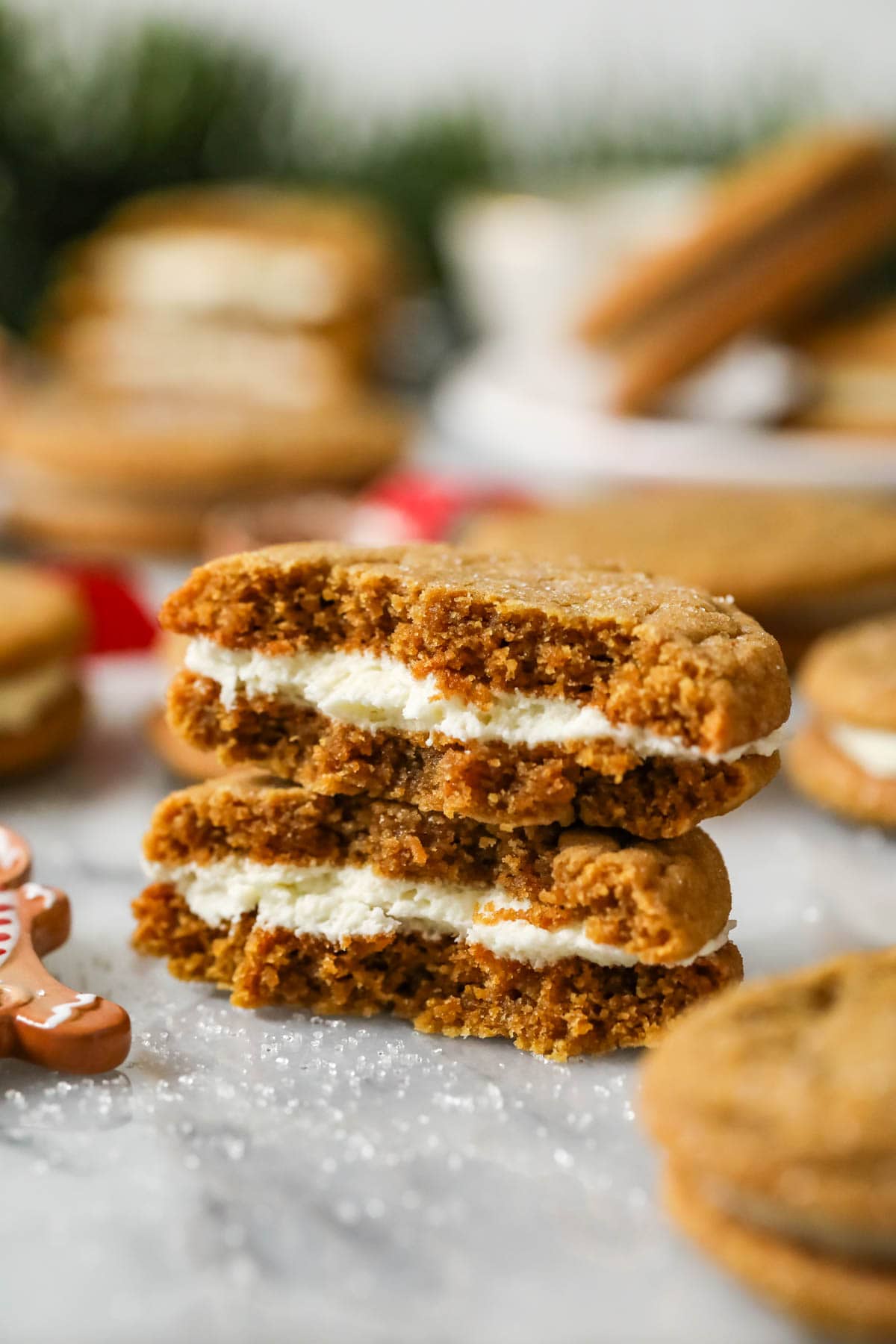 Two halves of a gingerbread sandwich cookie stacked on top of each other.