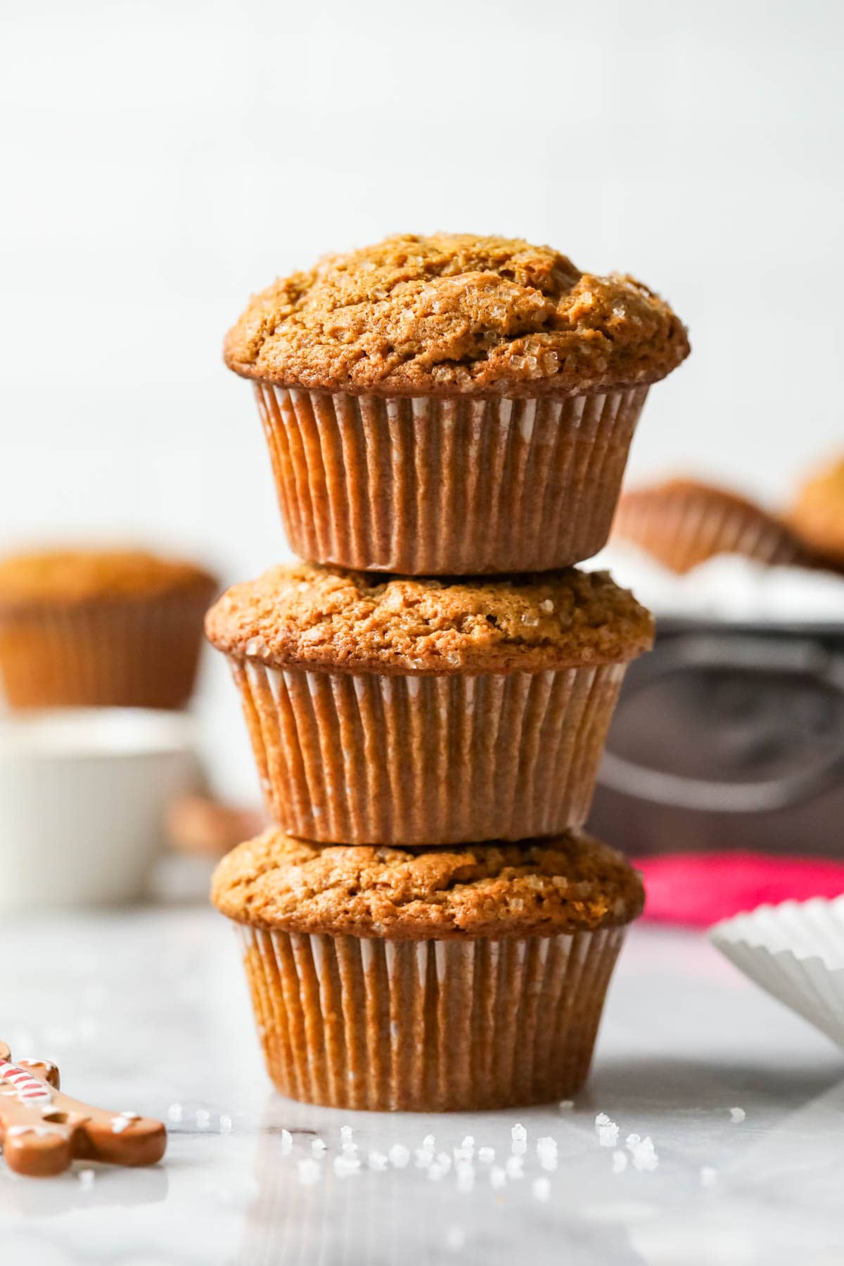 Three gingerbread muffins stacked on top of each other.