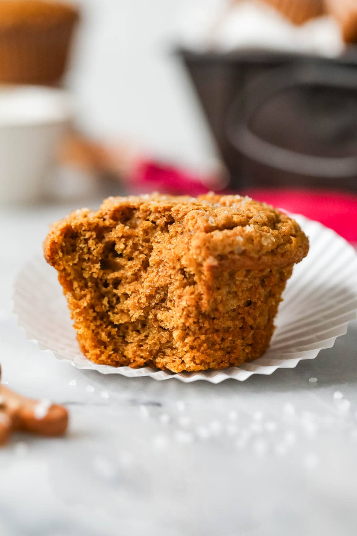 Gingerbread muffin with a big bite missing.