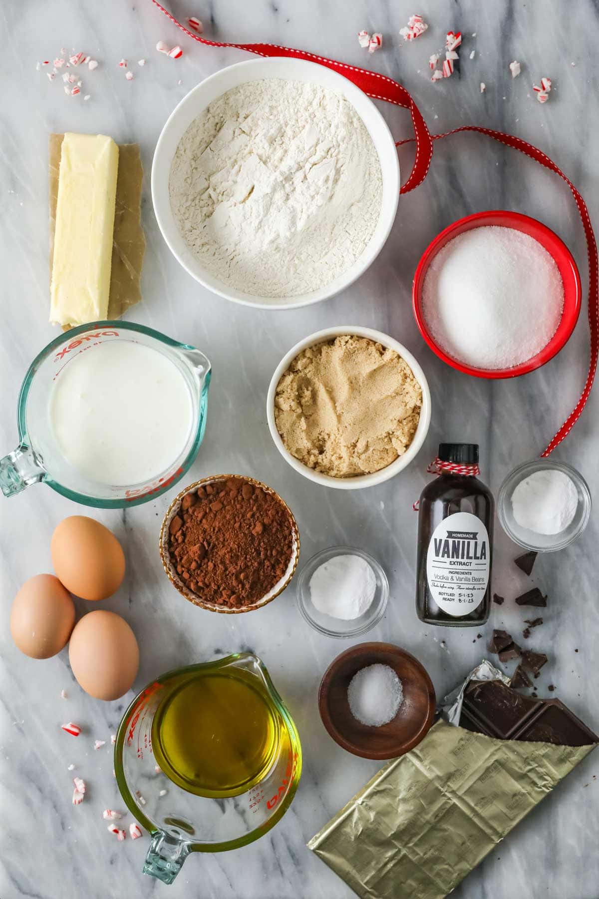 Overhead view of ingredients including cocoa powder, buttermilk, brown sugar, and more.