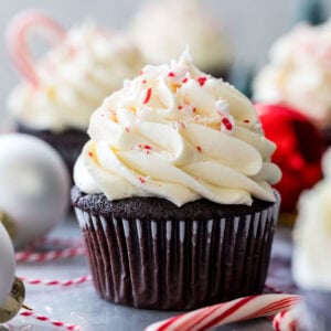 Peppermint bark cupcake topped with crushed peppermint candies.