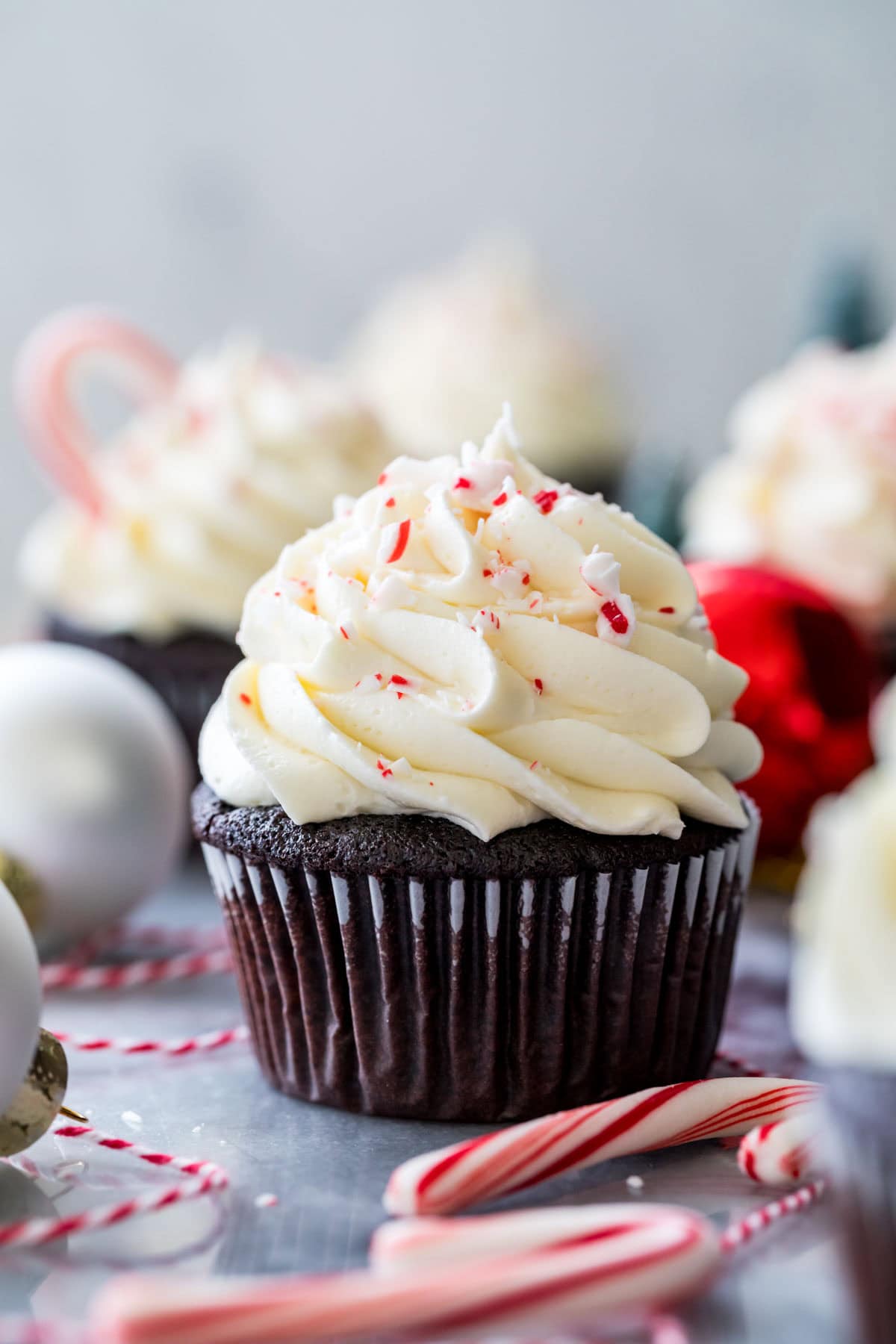 Peppermint bark cupcake topped with crushed peppermint candies.