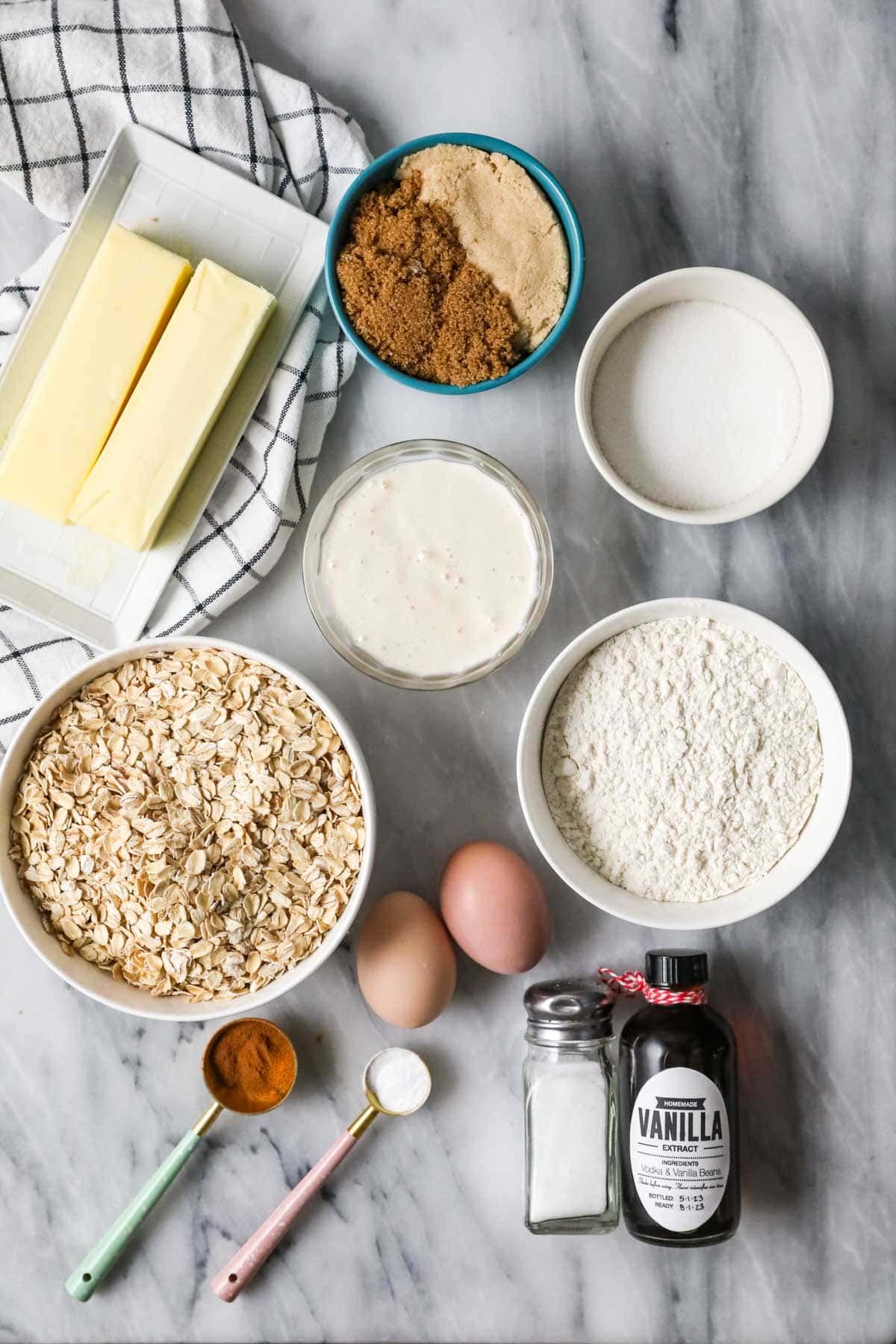 Overhead view of ingredients including oats, butter, sourdough discard, and more.