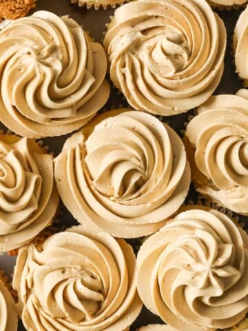 Overhead view of cupcakes frosted with brown sugar swiss meringue buttercream.