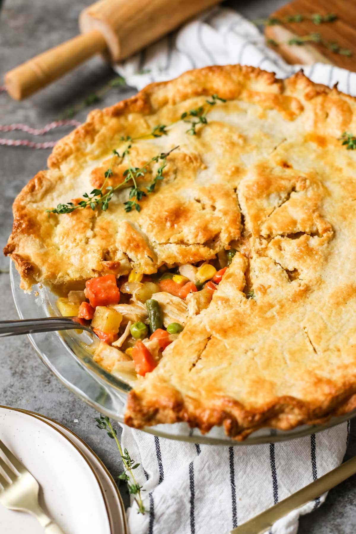 Slice of chicken pot pie removed to show the veggie filling inside.