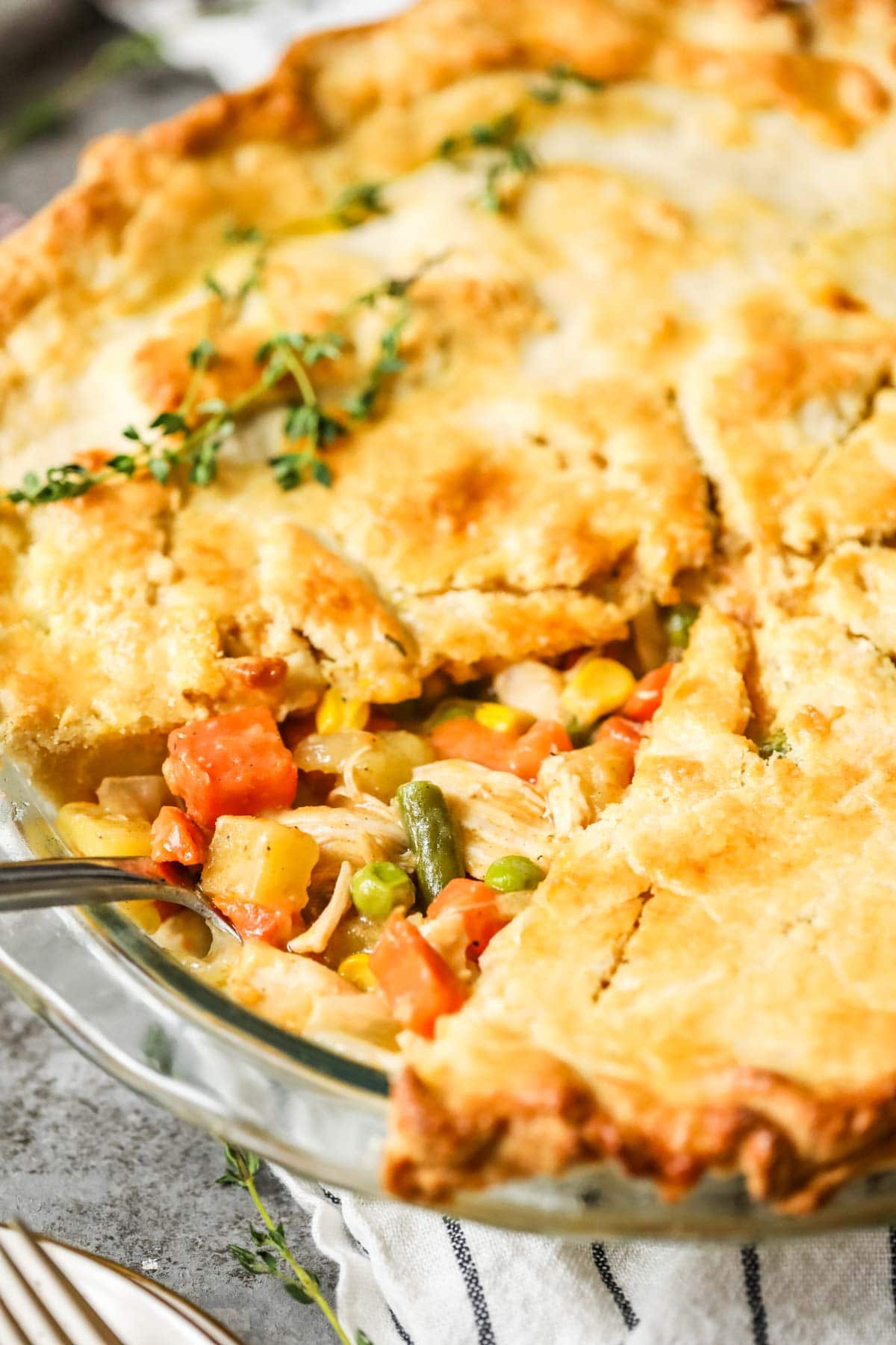 Slice of chicken pot pie removed to show the veggie filling inside.