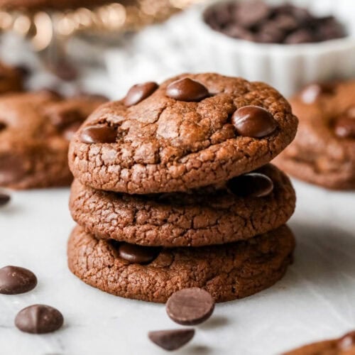 Stack of three double chocolate chip cookies.