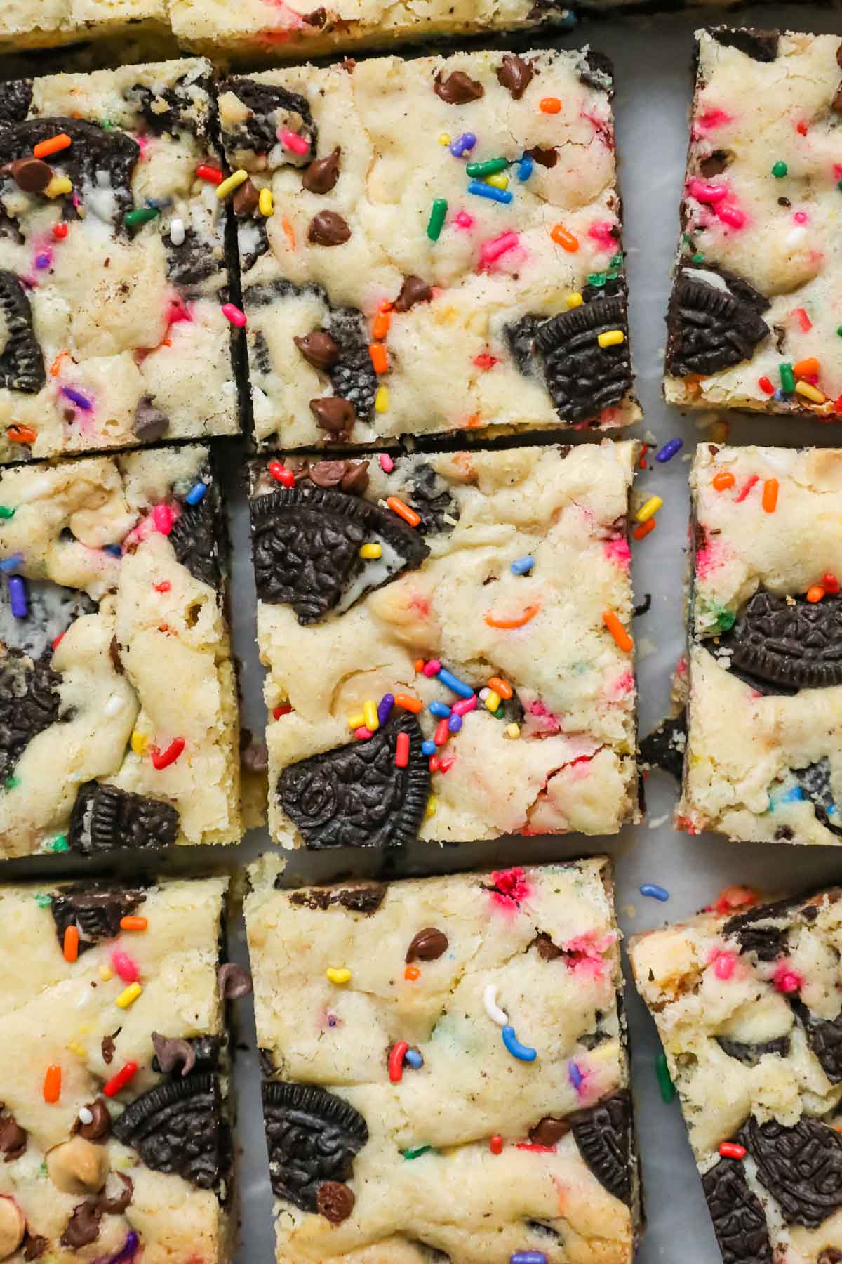 Overhead view of bars made with Oreos and sprinkles cut into squares.