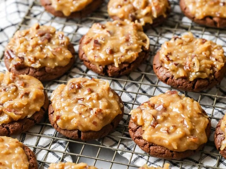 Rows of German chocolate cookies on a cooling rack.