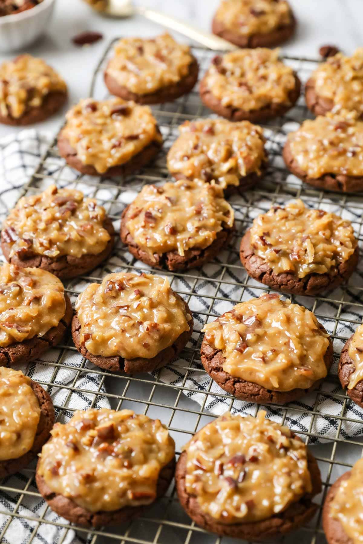 Rows of German chocolate cookies on a cooling rack.