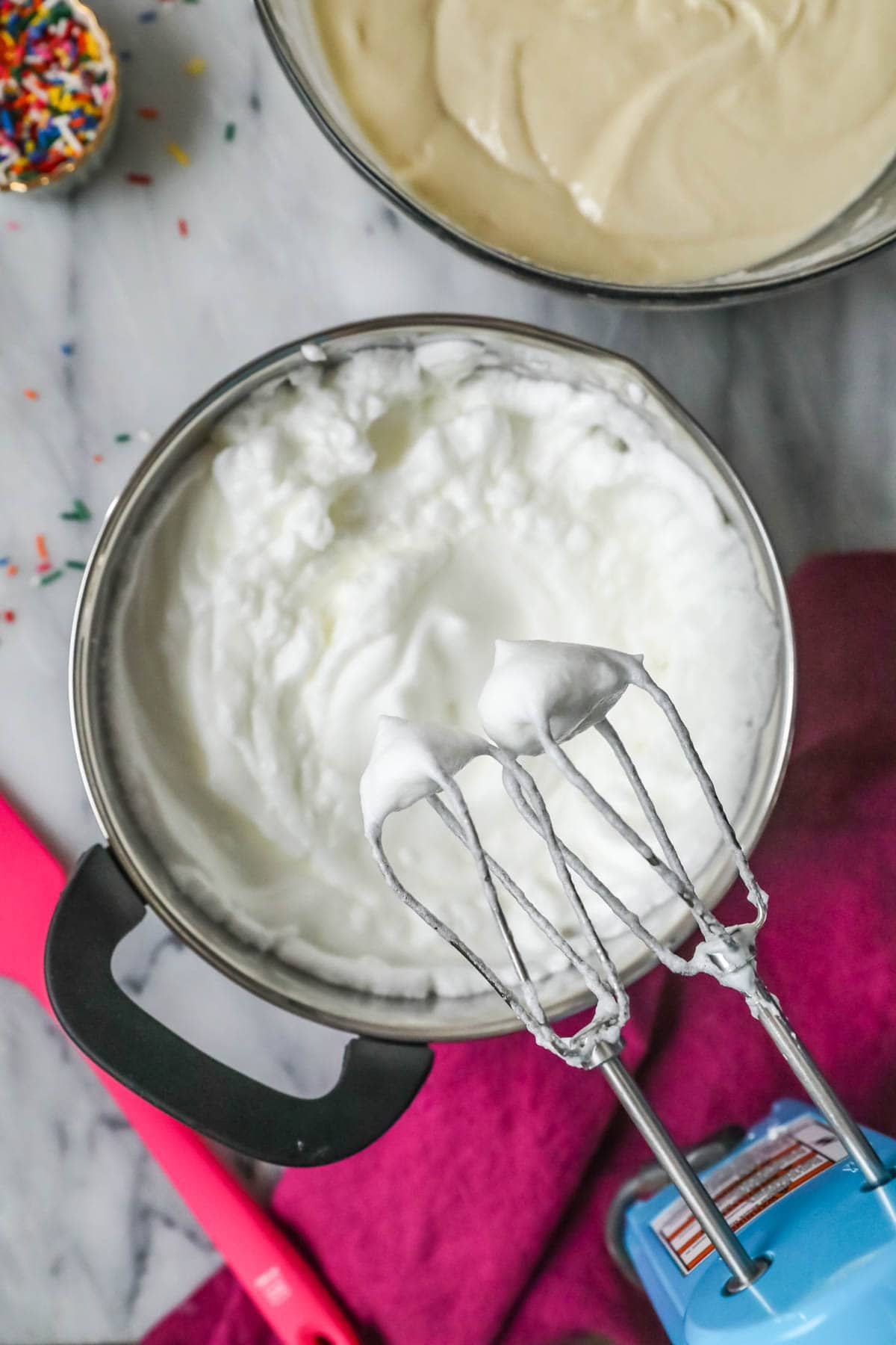 Overhead view of egg whites that have been whipped to stiff peaks.