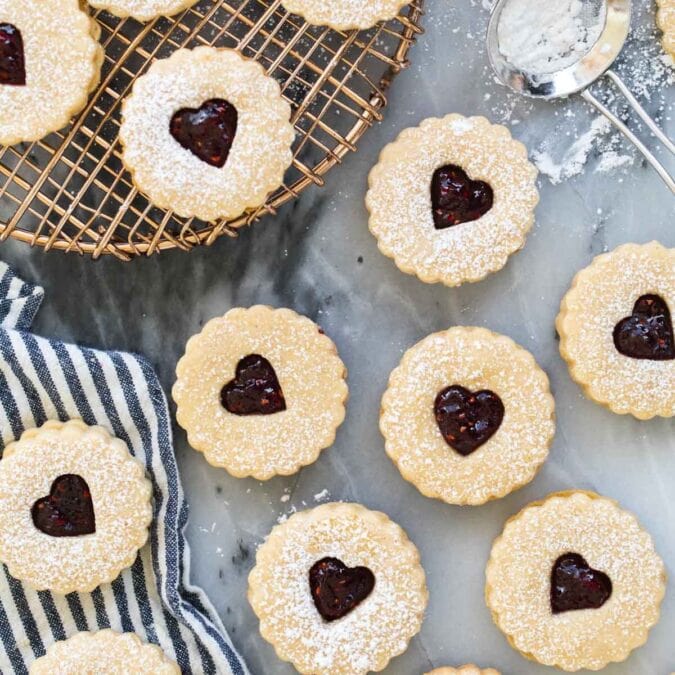 Overhead view of linzer cookies topped with powdered sugar.