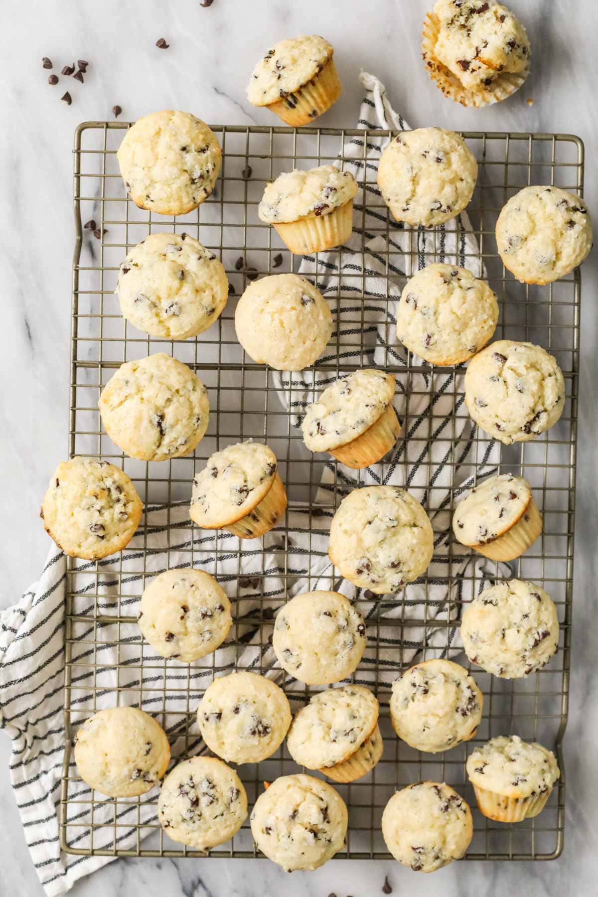 Overhead view of mini muffins on a cooling rack.