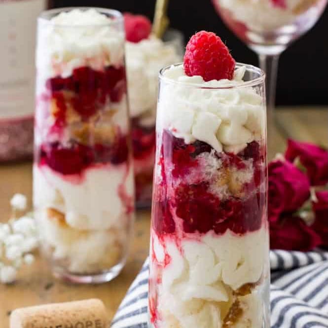 Raspberry chardonnay trifles in stemless champagne glasses.