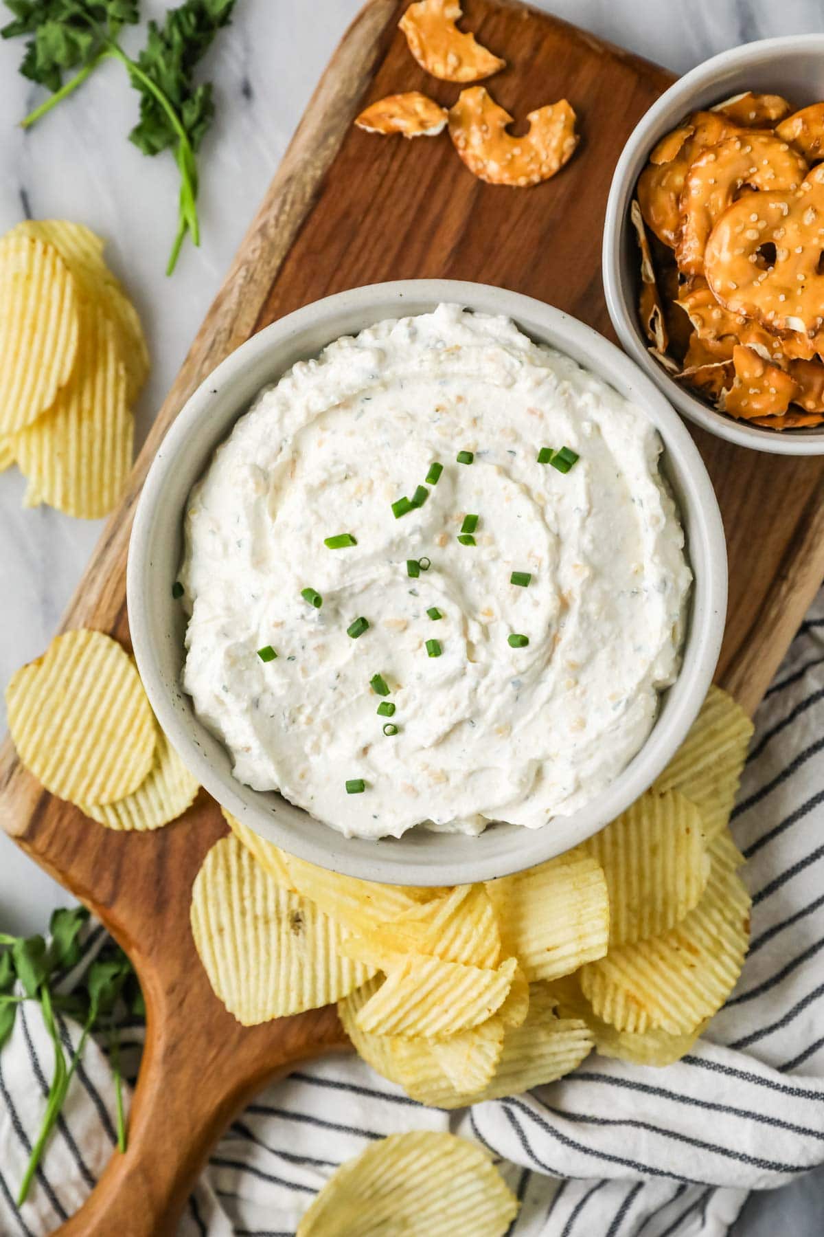 Overhead view of a bowl of homemade sour cream and onion dip.