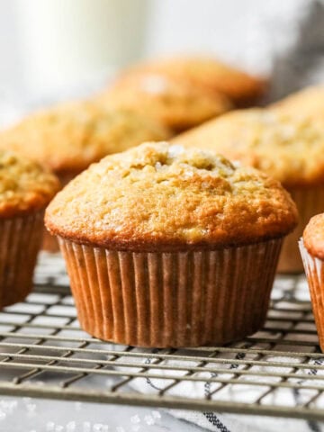 Rows of sourdough banana muffins on a cooling rack.