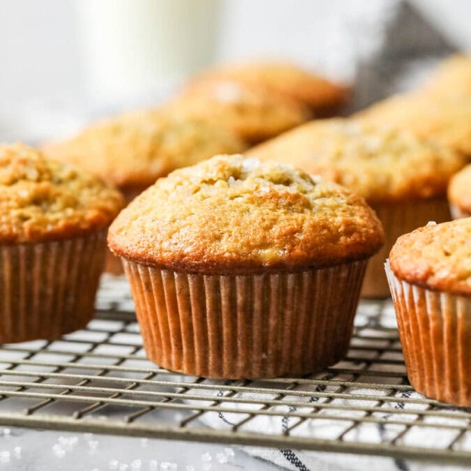 Rows of sourdough banana muffins on a cooling rack.