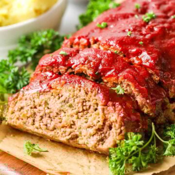 Meatloaf with one slice cut to show the interior.