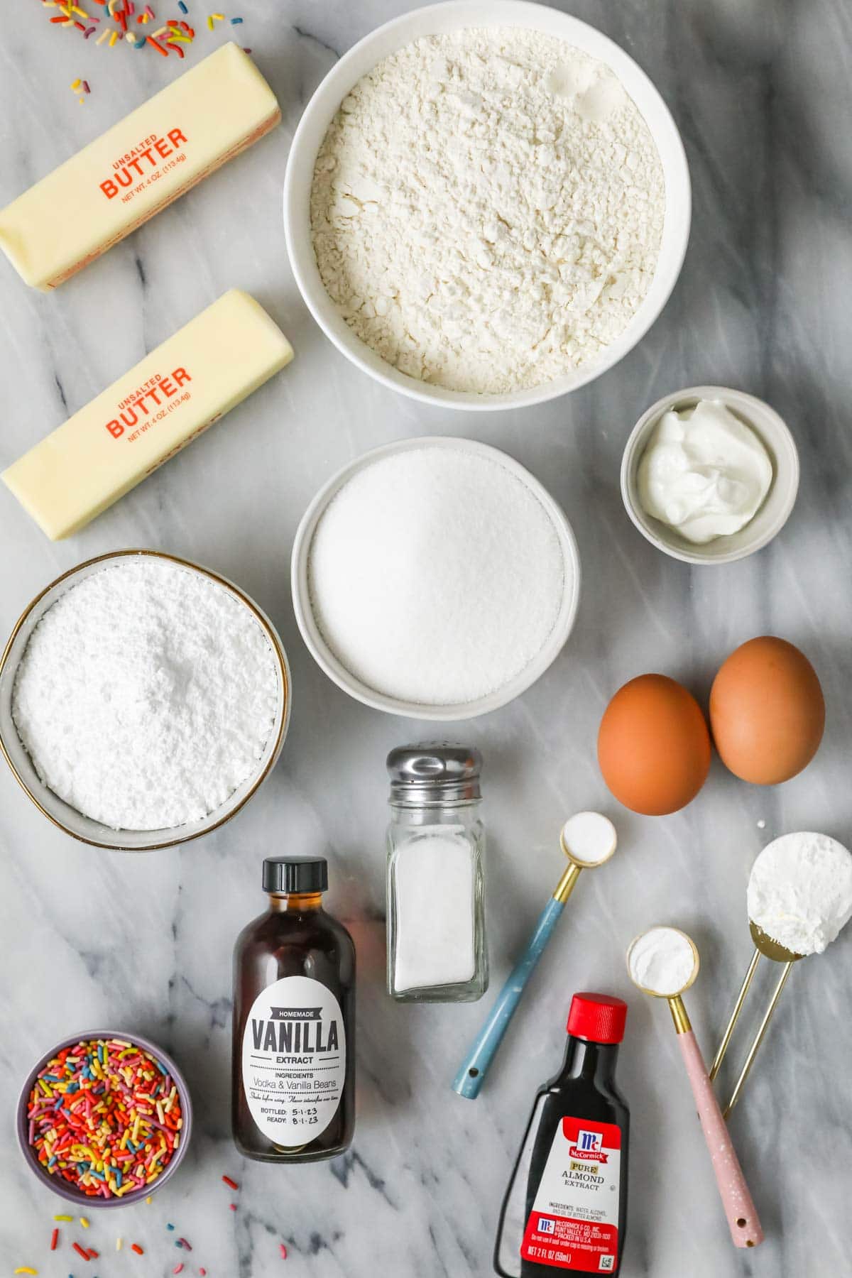 Overhead view of ingredients including butter, sprinkles, vanilla, and more.