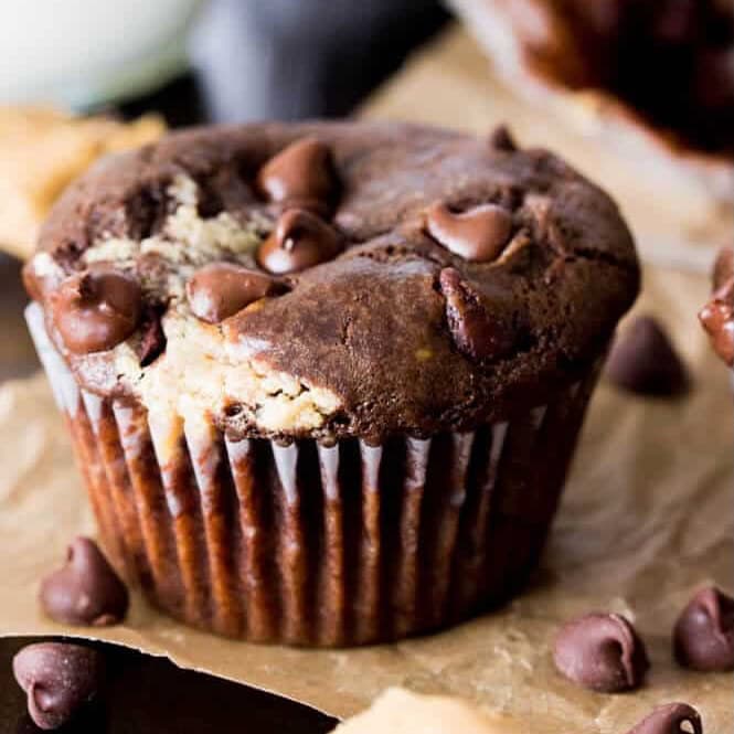 Peanut butter chocolate muffin topped with chocolate chips.