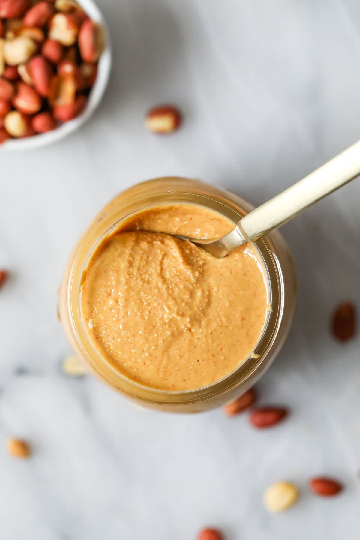 Elevated view of a can of homemade peanut butter.