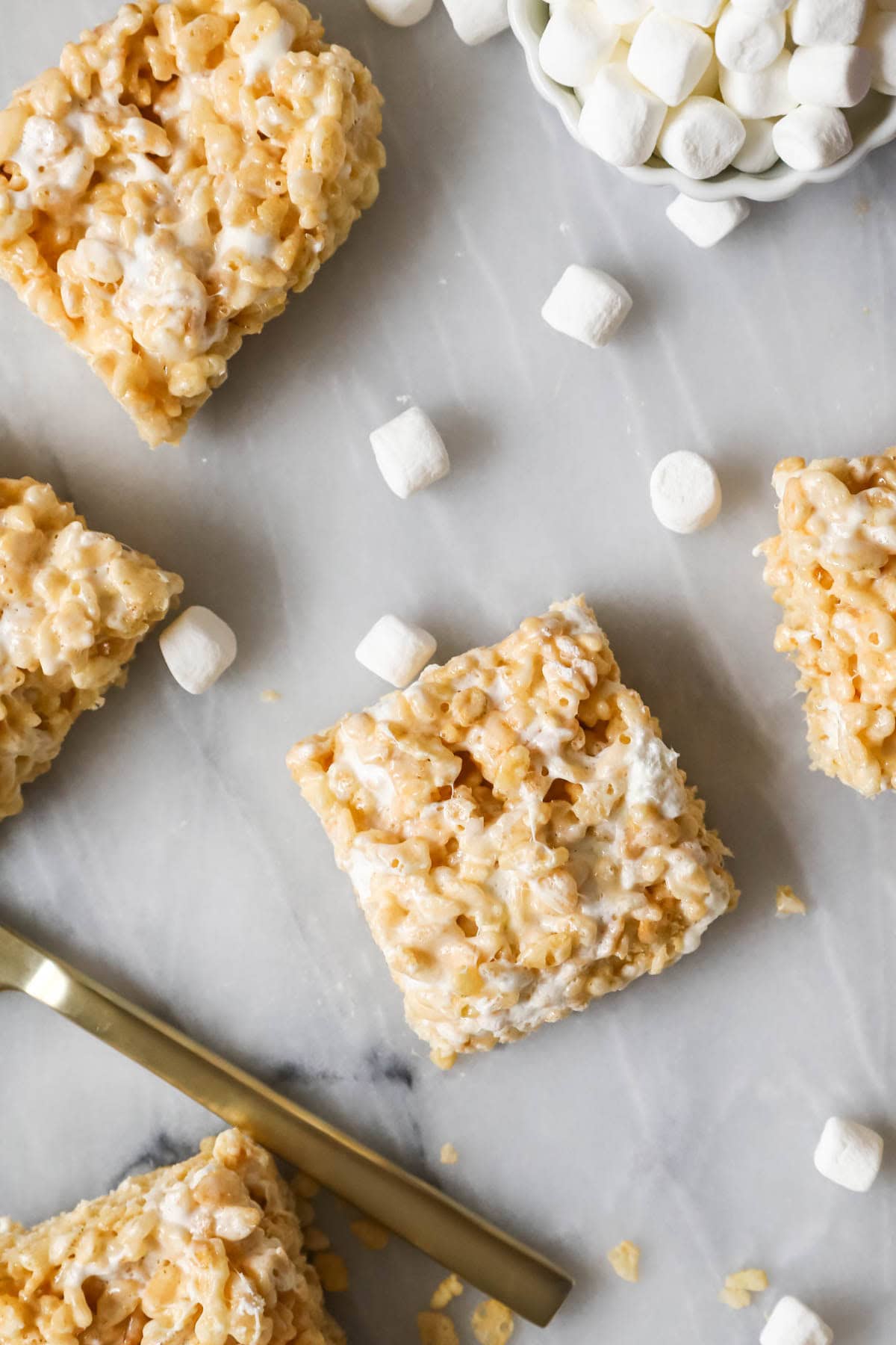 Overhead view of square cereal bars made with rice krispies and marshmallows.