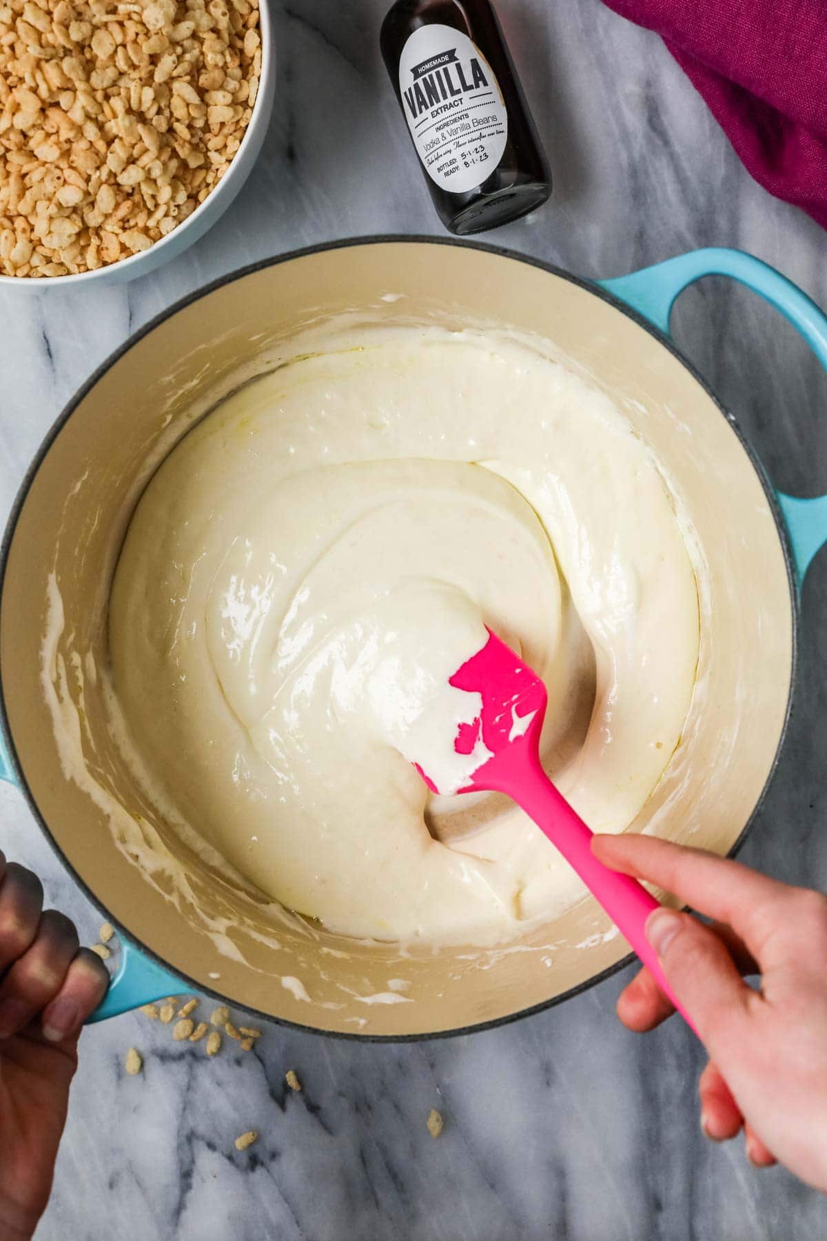 Overhead view of melted marshmallow and butter in a pan.